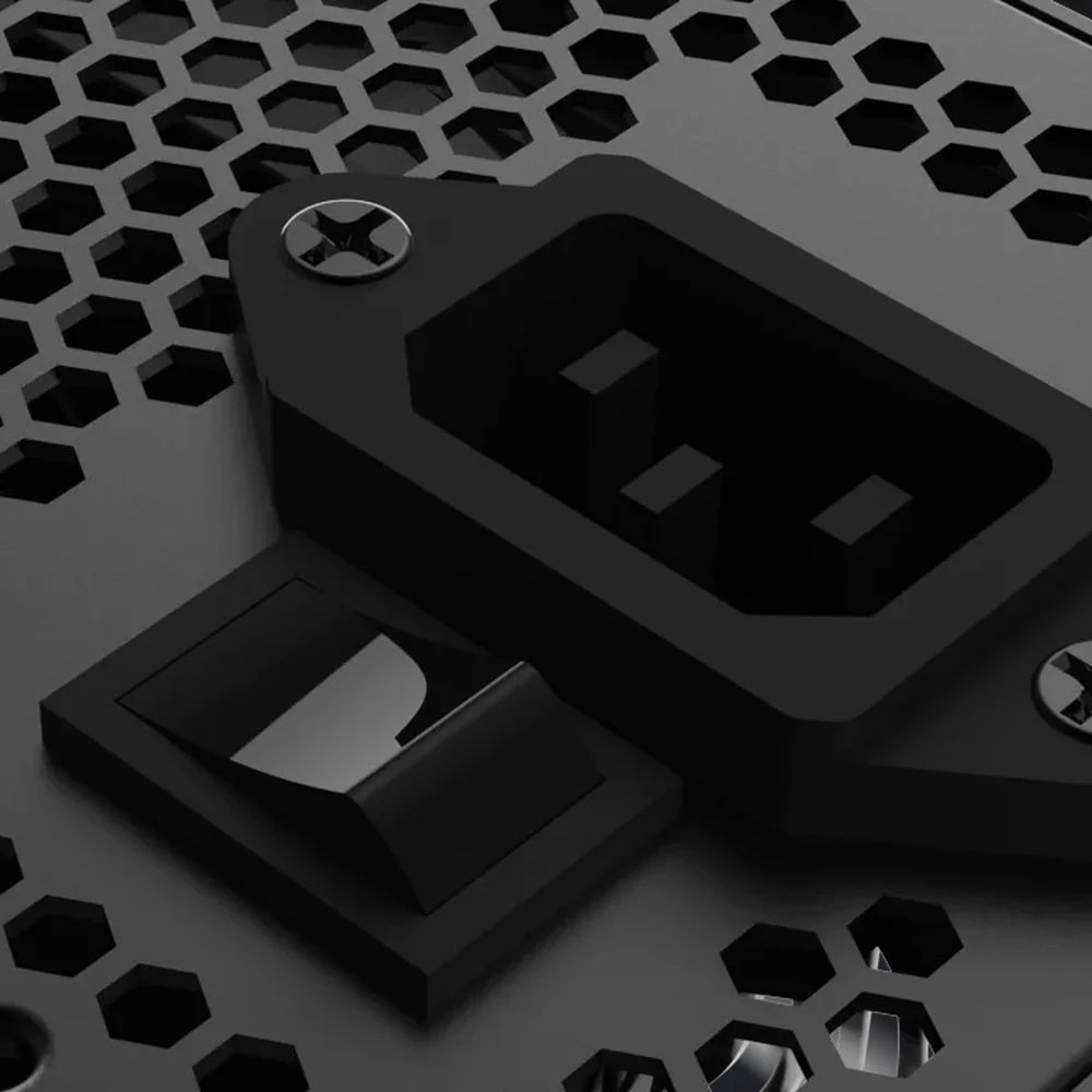 Close-up of the power socket, switch and honeycomb vents of the DU-550B